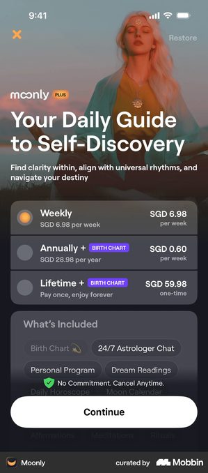 Moonly paywall headed Your Daily Guide to Self-Discovery over a photograph. Three plans are listed: Weekly at SGD 6.98 per week, Annually plus Birth Chart at SGD 28.98 per year shown as SGD 0.60 per week, and Lifetime plus Birth Chart at SGD 59.98 one-time. Below sits a What's Included panel with pills reading Birth Chart, 24/7 Astrologer Chat, Personal Program and Dream Readings, a line reading No Commitment Cancel Anytime, and a white Continue button