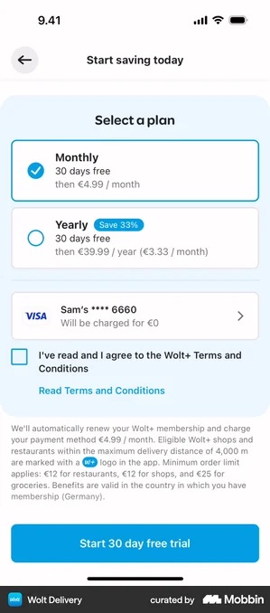 Wolt Delivery plan screen with monthly selected, a Visa card row reading Will be charged for 0 euro, an empty blue-outlined checkbox beside I've read and I agree to the Wolt+ Terms and Conditions, a paragraph of renewal terms, and a fully blue Start 30 day free trial button